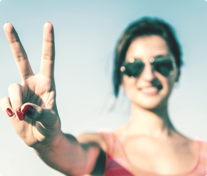 Young woman showing peace sign